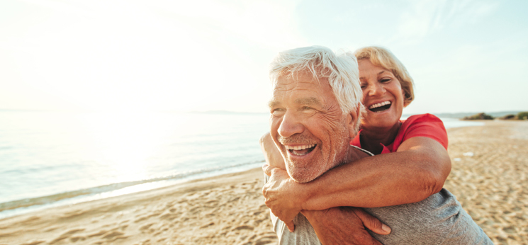 hearing aids melting - Couple having fun at the beach