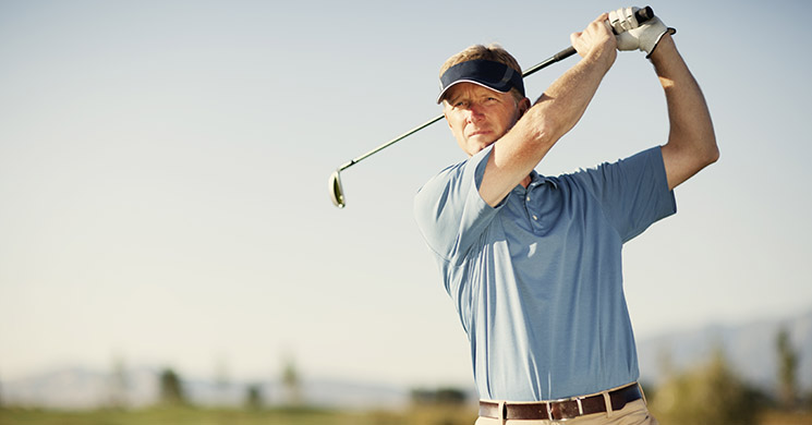 dealing with sweat and hearing aids - man playing golf