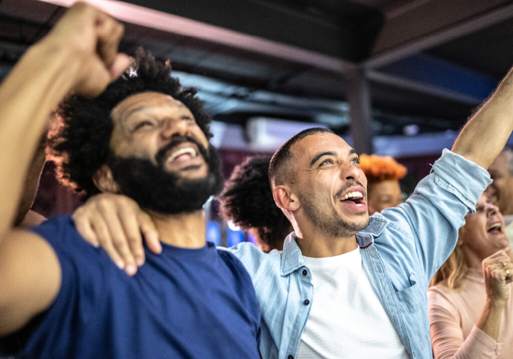 Two young men cheering